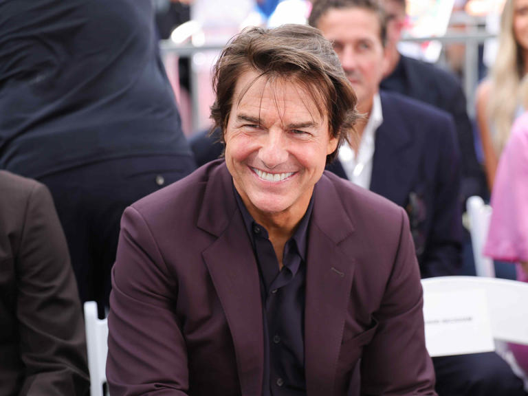 Tom Cruise looks unrecognizable with stark white hair and facial prosthetics