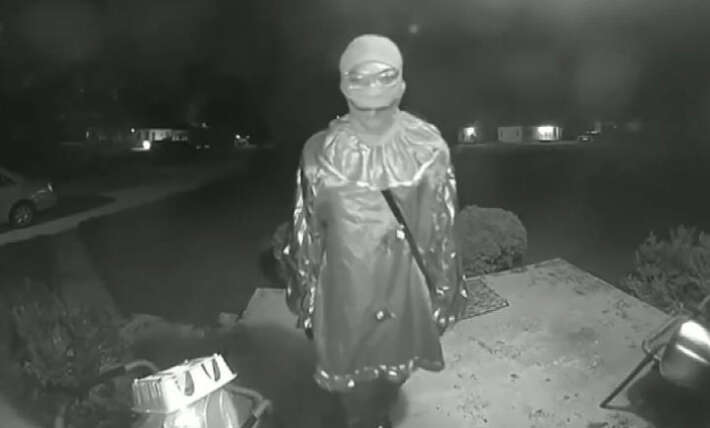 Teen in clown costume stabbed elderly man to death at bus stop and whispered warning in eerie doorbell video, officials say