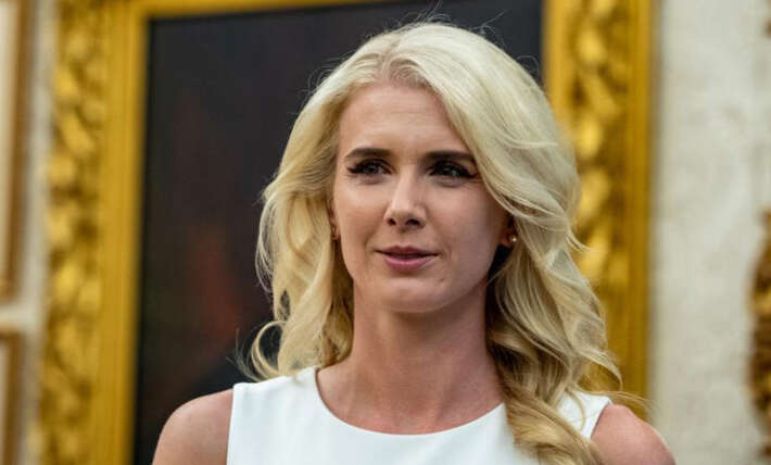 Trump’s ‘most beautiful’ aide shows off new look as she looks adoringly at President Trump