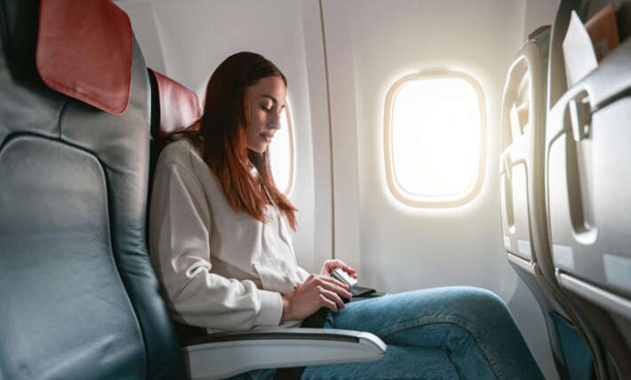 A traveler got an empty row on a 13-hour flight. Then another family moved in