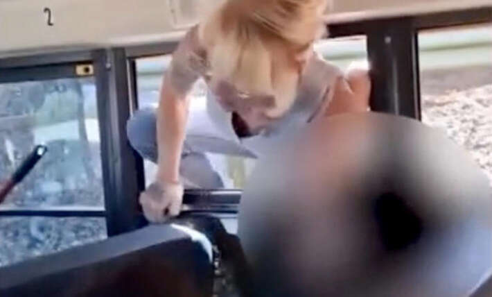 Mayhem on California school bus as parents smash inside and kids forced to climb out windows