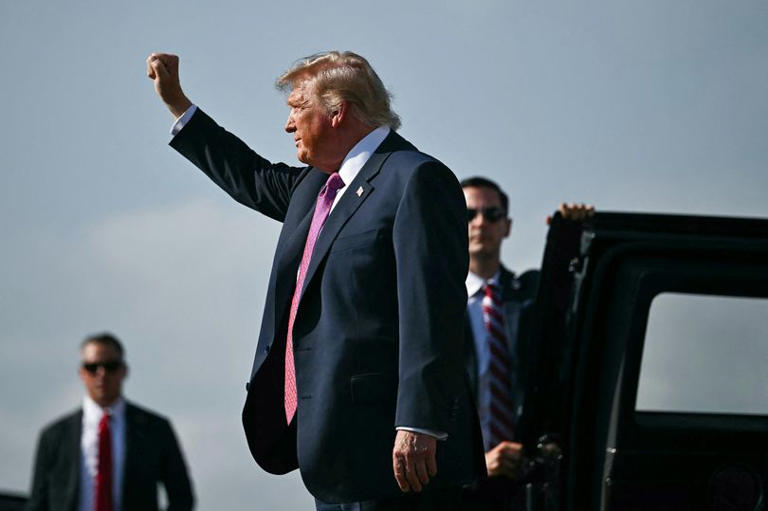 Trump’s ‘hair piece’ loses fight with wind on tarmac as he heads to Texas