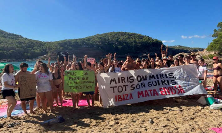 Anti-tourism activists descend on ‘overcrowded’ beach at iconic vacation destination for partygoers