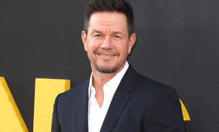 Mark Wahlberg poses with his 2 sons Michael and Brendan in red carpet appearance at premiere for “By Any Means”