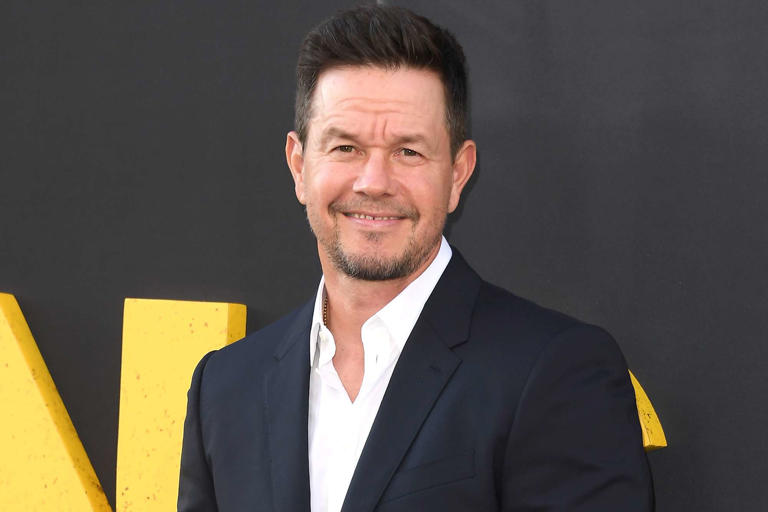 Mark Wahlberg poses with his 2 sons Michael and Brendan in red carpet appearance at premiere for “By Any Means”