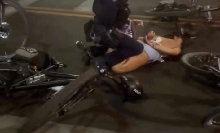 Viral video captures Arizona State cheerleader being shoved to ground, pummeled by cops as she tries to stop arrest