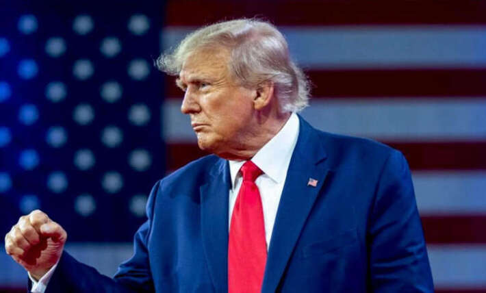 Trump’s wind blown Houston arrival sparks hair jokes before Artemis II honors