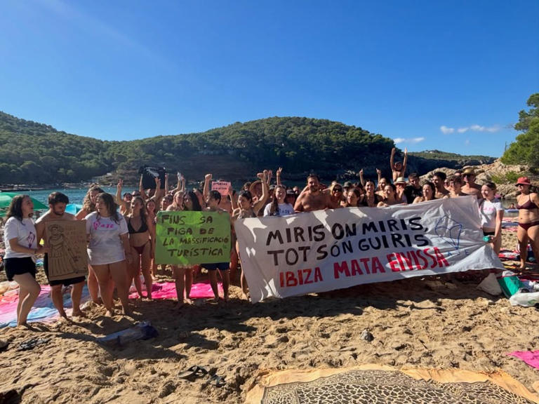 Anti-tourism activists descend on ‘overcrowded’ beach at iconic vacation destination for partygoers