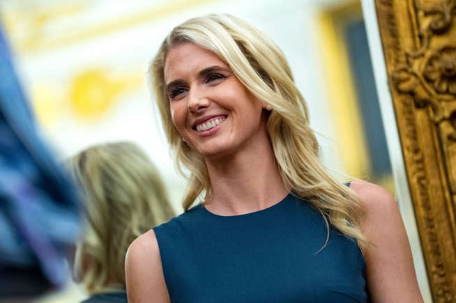 Natalie Harp’s reflection spotted in mirror as she makes gross gesture to Donald Trump